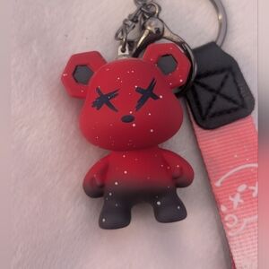 Red and Black gradient bear keychain with white speckles and a matching wristlet